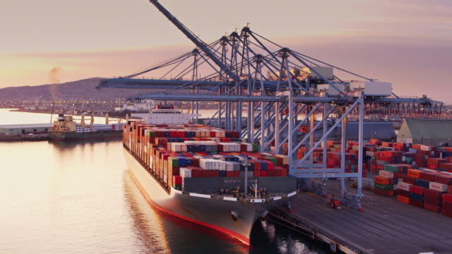 Flight Over Cargo Ship at Sunset in Port of Long Beach