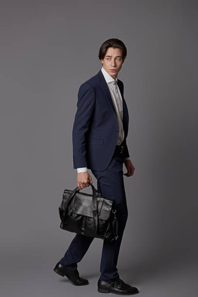 istock Young businessman full length profile portrait 918318082