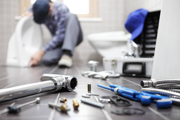 plumber at work in a bathroom, plumbing repair service, assemble and install concept plumber at work in a bathroom, plumbing repair service, assemble and install concept installing stock pictures, royalty-free photos & images