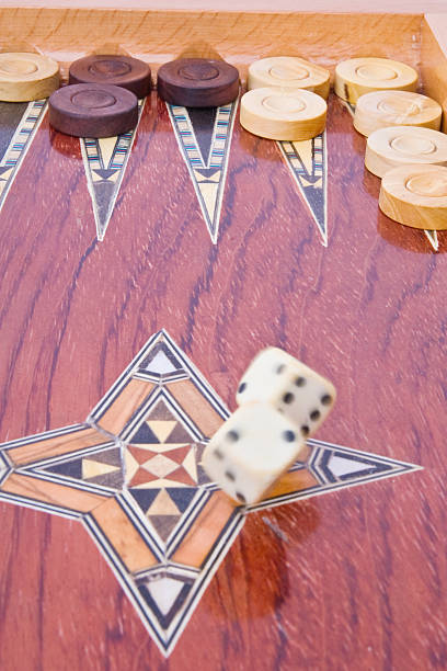 istock White big dices falling on wooden handmade backgammon board 91832159