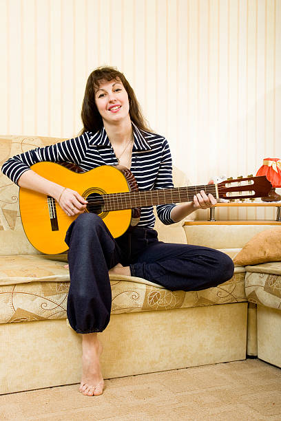 istock Young woman with a guitar 91832259