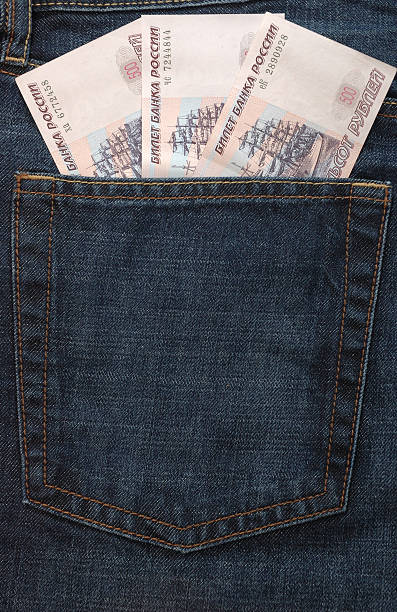 Russian money in jeans pocket stock photo