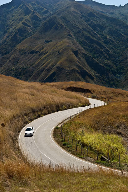 istock Road in the mountains with one car 91832518