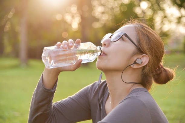 istock Asian female is resting and drinking water. 918325494