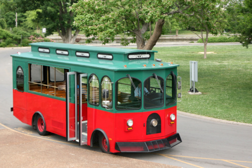 A driver waits for his passengers in a retro style trolley.