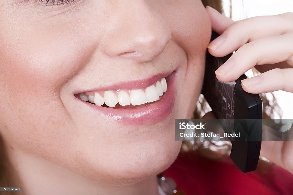 Female holding cellphone  Adult Stock Photo