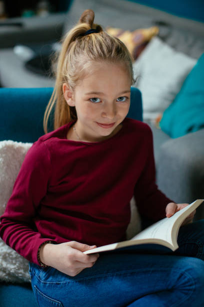 istock Beautiful girl enjoying the book 918329812