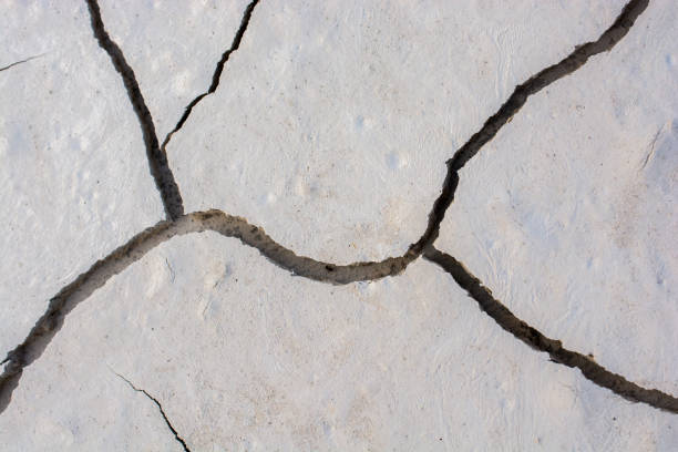 istock Brown color dry cracked muddy earth 918335730