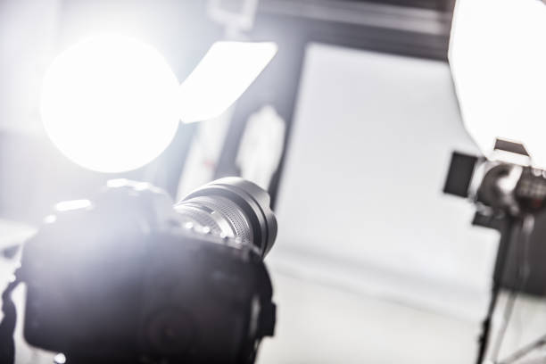 istock Photograpy studio with lighting equipment and a camera. 918337970