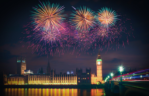 Firework show over Big Ben at night, London, UK.