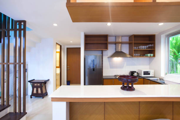 istock Luxury interior design pool villa in kitchen area which feature island counter and built in furniture 918352954