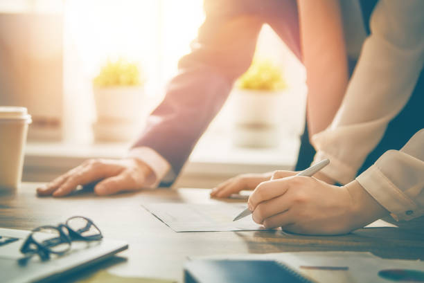 istock Man and woman working in the office 918353050