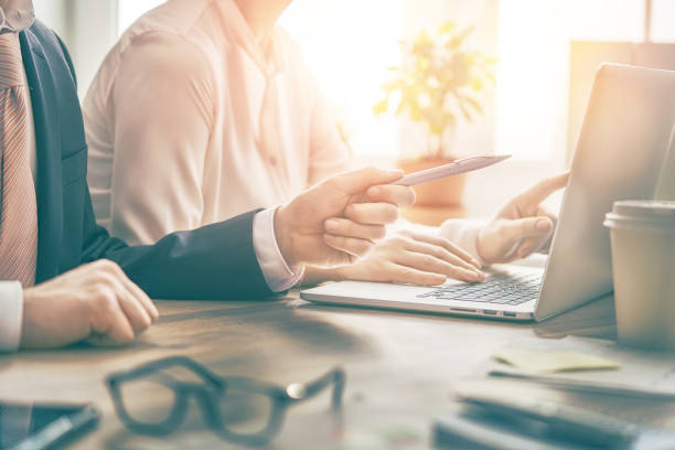 istock Man and woman working in the office 918353118