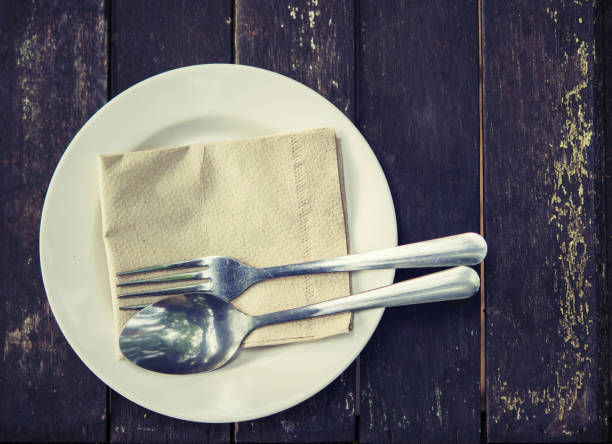 istock Vintage of spoon and fork on white plate 918355604