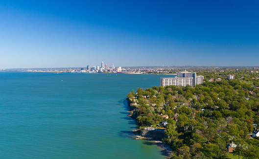 View of the Cleveland area coastline with Lake Erie on the left, city/suburb of Lakewood in the foreground, and Cleveland skyline in the far distance.