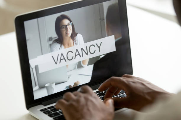 istock African unemployed man browsing web service for job search online 918364526