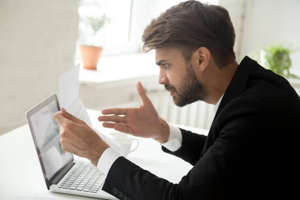 istock Angry businessman feeling indignant disagree with information in mail letter 918364584