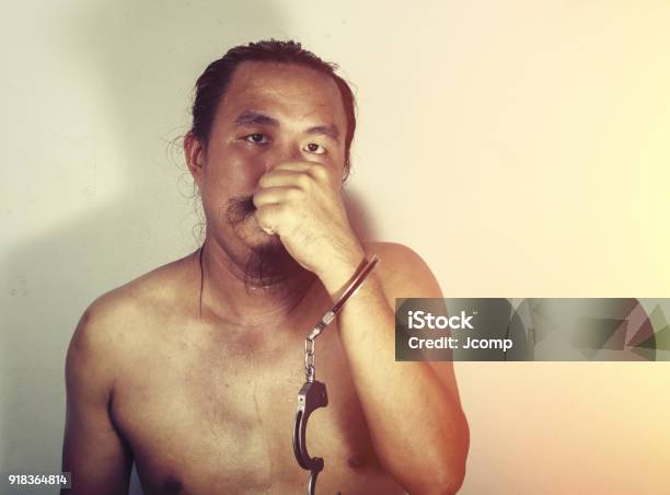 Portrait Of A Man Prisoner With Handcuff Stock Photo - Download Image Now - Adult, Behind, Bizarre