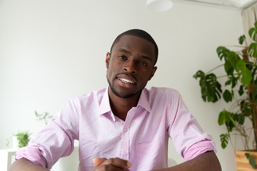 African-american man talking looking at camera, black man vacancy candidate making video call for distance job interview, dark-skinned vlogger recording videoblog, view from webcam, headshot portrait