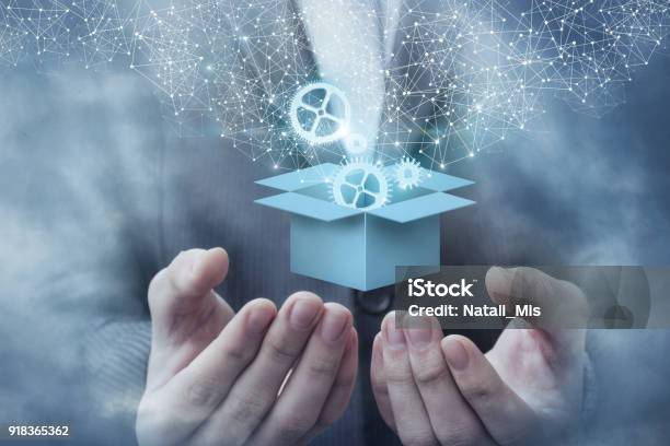 Box In Hand Is Open With The Mechanism Stock Photo - Download Image Now - Merchandise, New, Connection