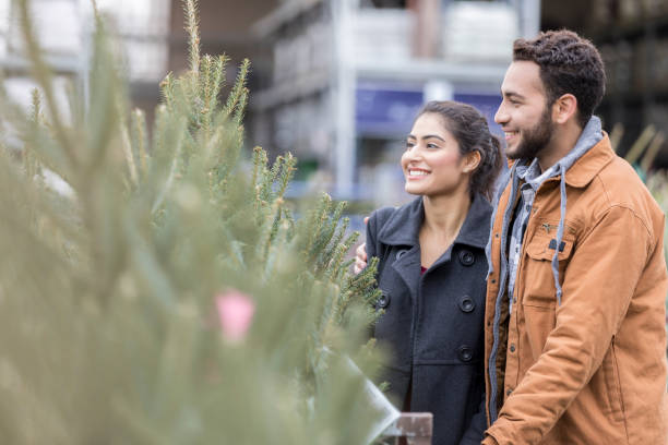 istock Excited young couple pick out their first Christmas tree 918377510