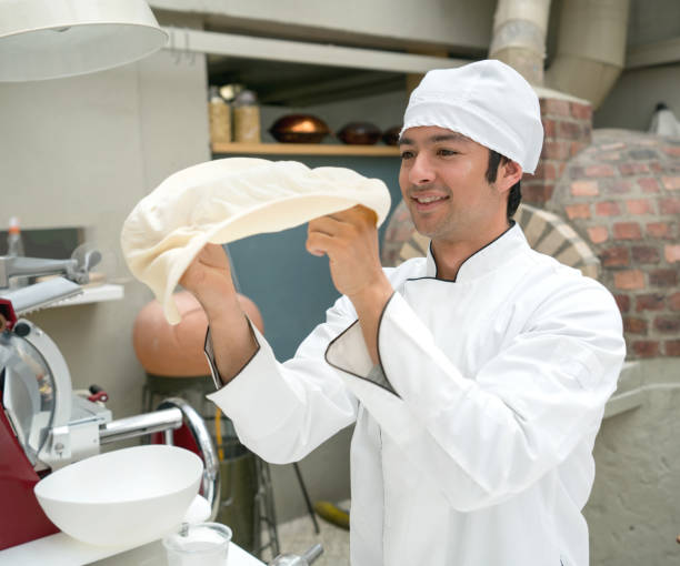 istock Chef making pizza at an Italian restaurant 918377592