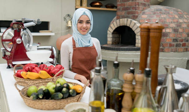 Muslim waitress working at a restaurant
