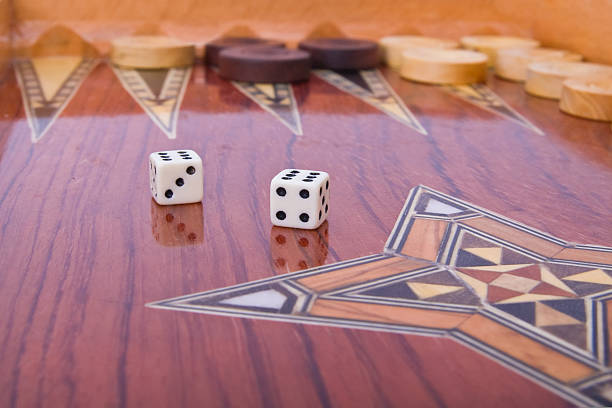 istock Two dices with reflection on wooden handmade backgammon board 91838177