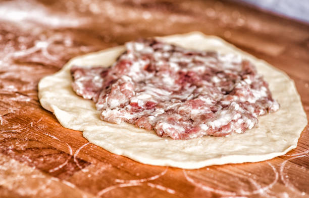 istock cooking a homemade raw meat pie 918385110