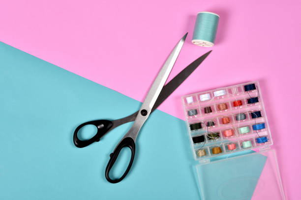 istock Thread rolls and scissors, Group of colorful thread on sewing desk, Craft, sewing and needlework concept. 918385486