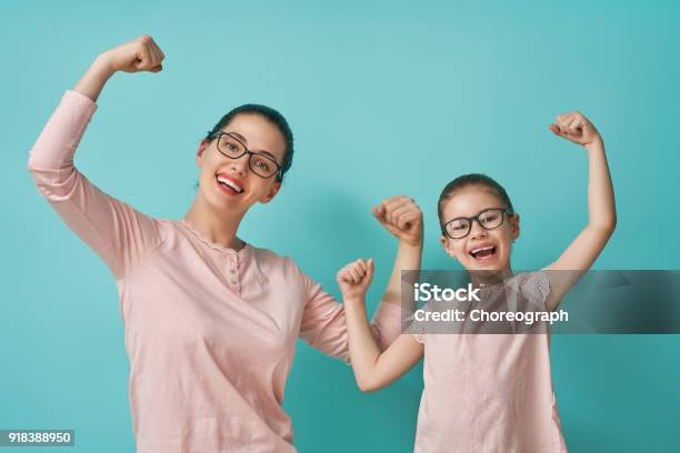 Mother And Her Daughter Stock Photo - Download Image Now - Mother, Eyeglasses, Strength