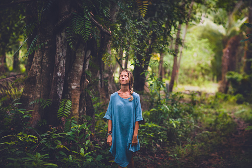 Portrait of beautiful woman in rainforest