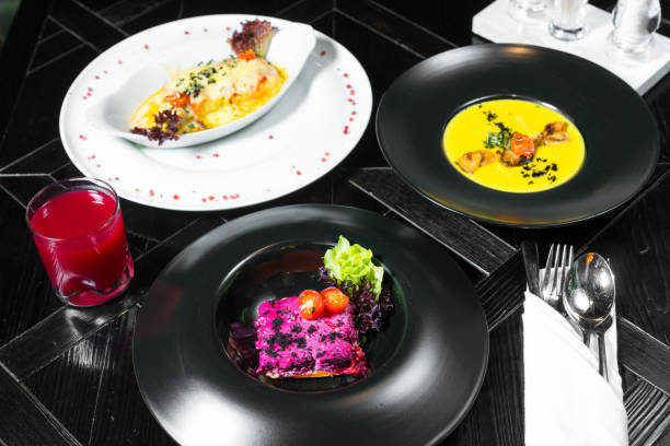 Set dinner of three courses. Chef's specialty presented in restaurant on served table. Clouse up.