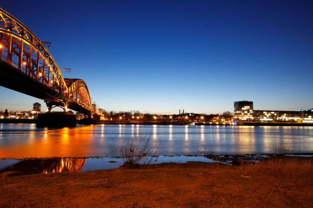 istock Illuminated South Railway Bridge at night, Cologne, Germany 918399412