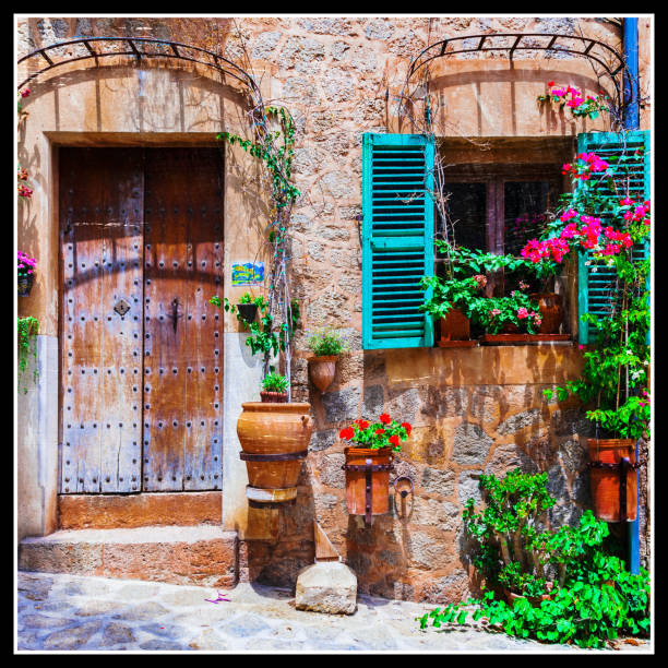 old narrow streets of medieval villages decorated with flowers
