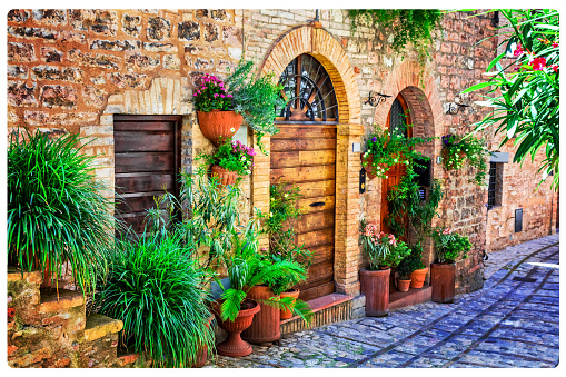 old narrow streets of medieval villages decorated with flowers