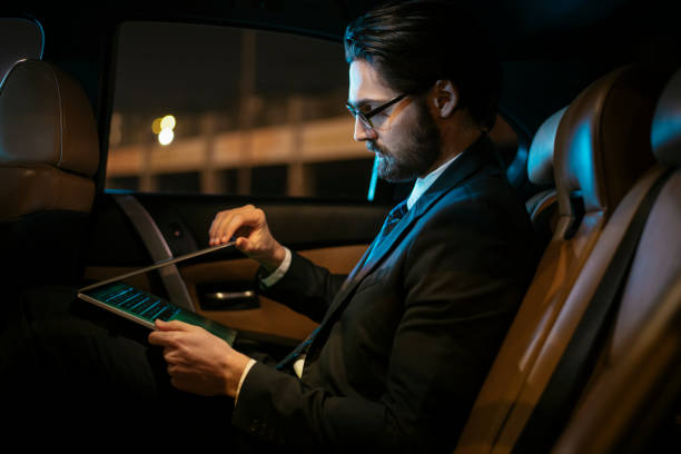 istock Businessman in car at back seat 918402968
