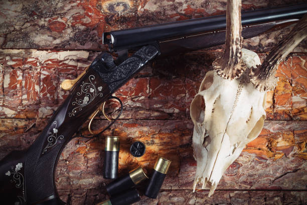 istock Hunting equipment on old wooden background 918403210