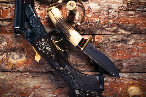 istock Hunting equipment on old wooden background 918403300