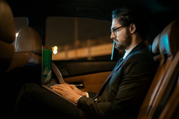 istock Businessman in car at back seat 918403338