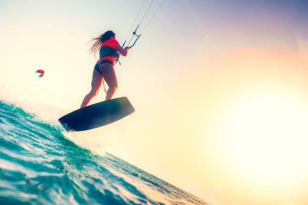 istock Female kiteboarder in mid-air 918406094
