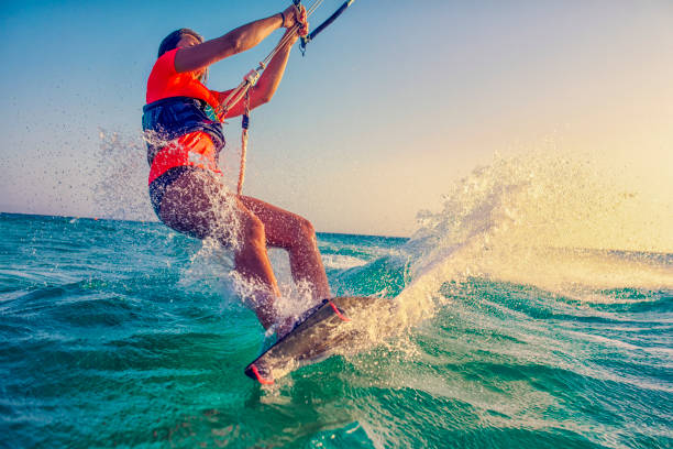 istock Female kitesurfer on turquoise water 918406610