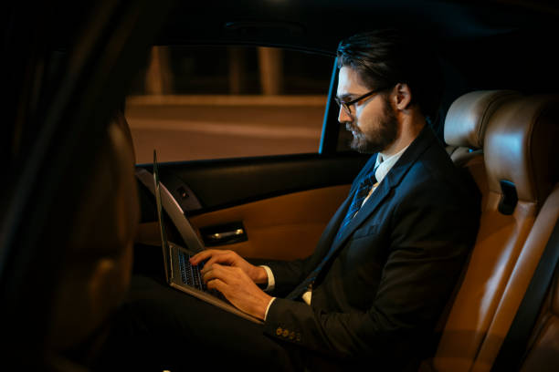 istock Businessman in car at back seat 918407212