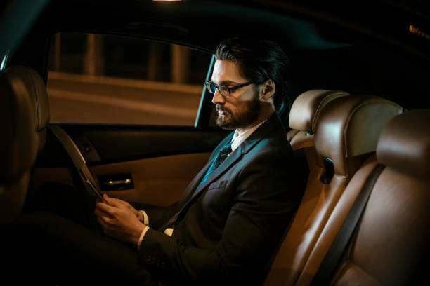 istock Businessman in car at back seat 918409790