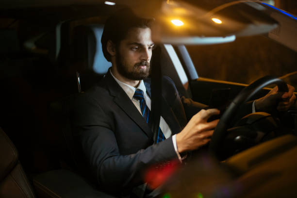 istock Businessman in car at night 918413382