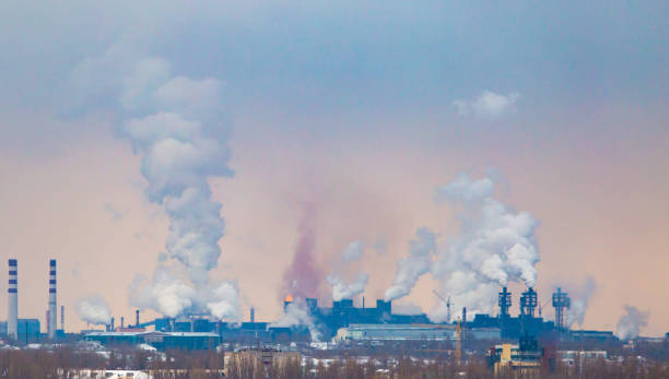 istock Smoke from the pipes in the factory 918414596