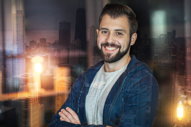istock Positive man standing with his arms crossed and smiling 918419146