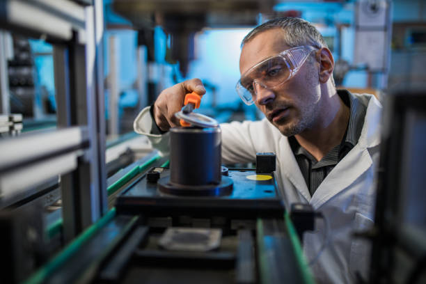 istock Focused mid adult engineer working on machinery in laboratory. 918422084
