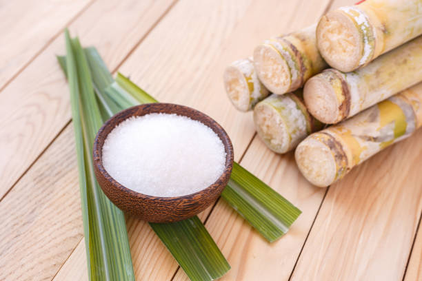 istock White sugar and sugar cane on wooden table background 918422318