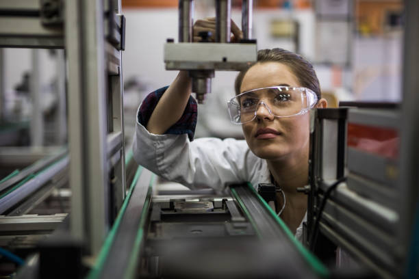 istock Female engineer examining machine part on a production line. 918422598